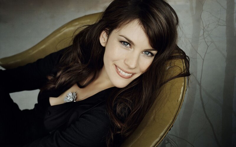 woman smiling in a chair