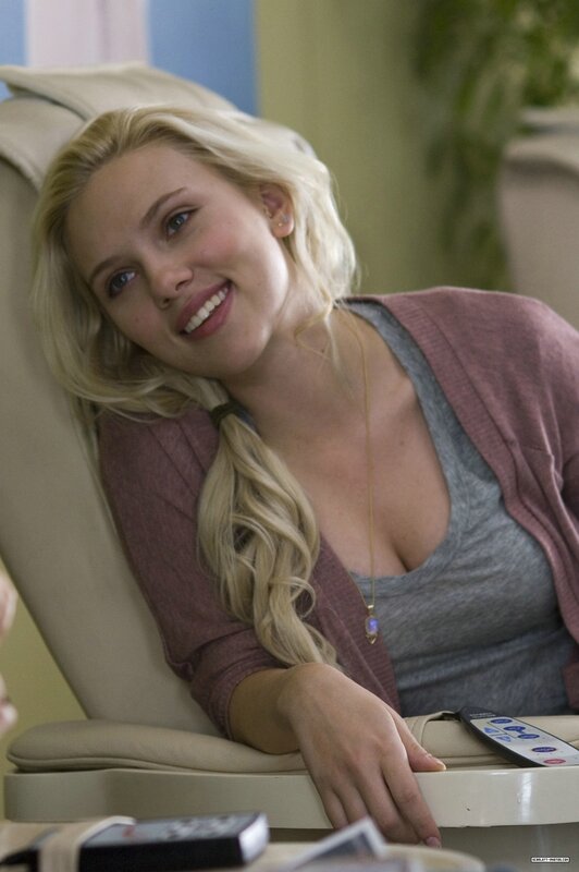 woman smiling in a chair