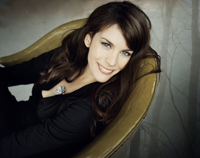 woman smiling in a chair