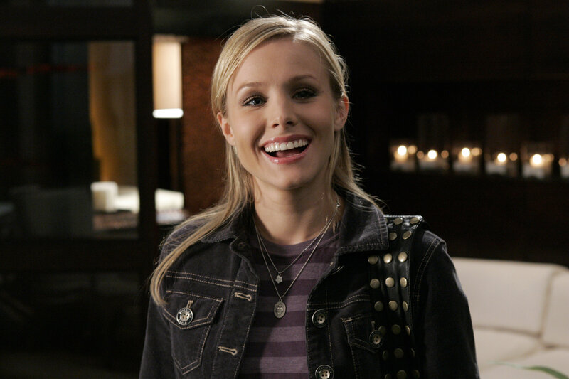 woman smiling in a dark room