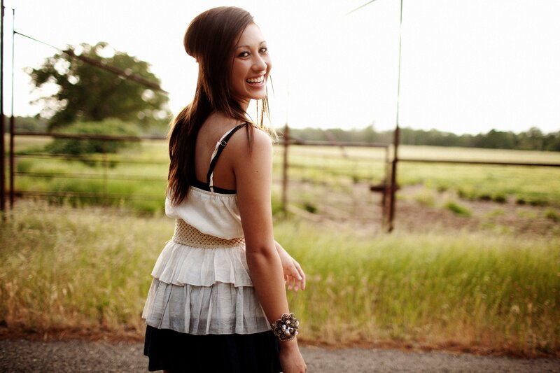 woman smiling in a field