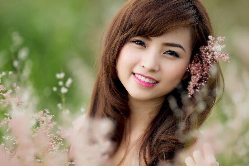 woman smiling in a field