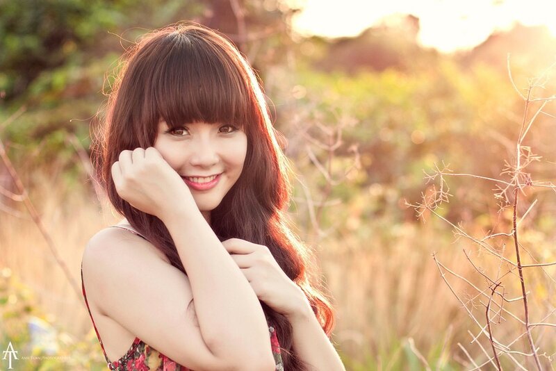 woman smiling in a field