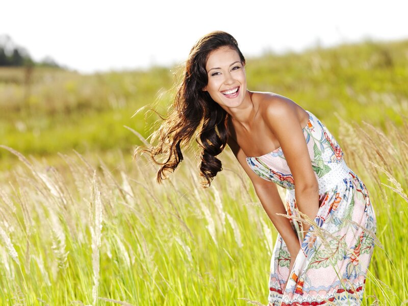 Woman smiling in a field