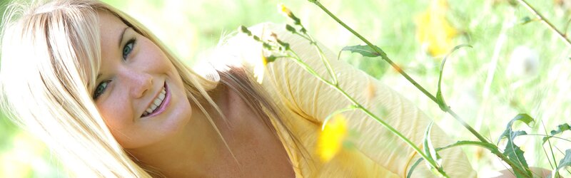 woman smiling in a field