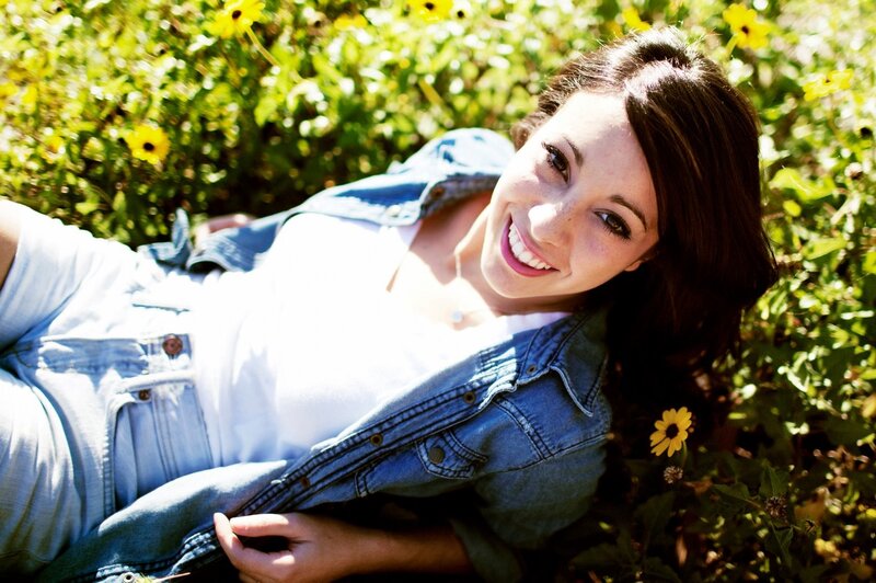 woman smiling in a field