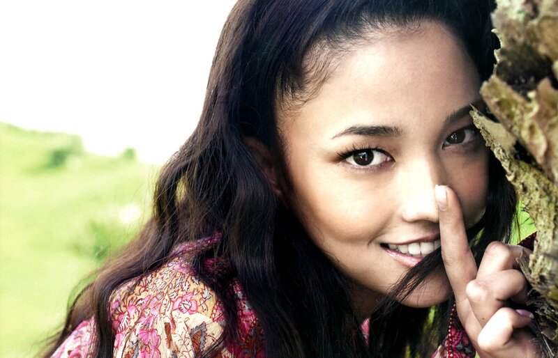 woman smiling in a field