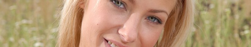 woman smiling in a field