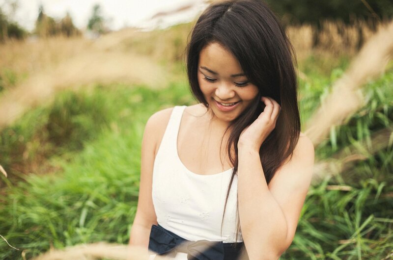 woman smiling in a field