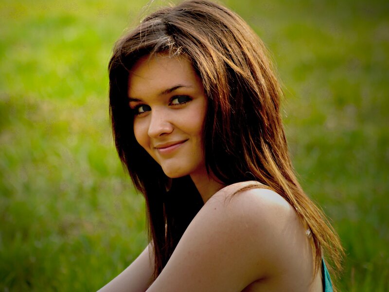 woman smiling in a field