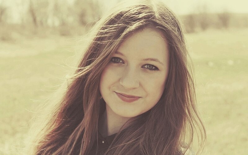 woman smiling in a field