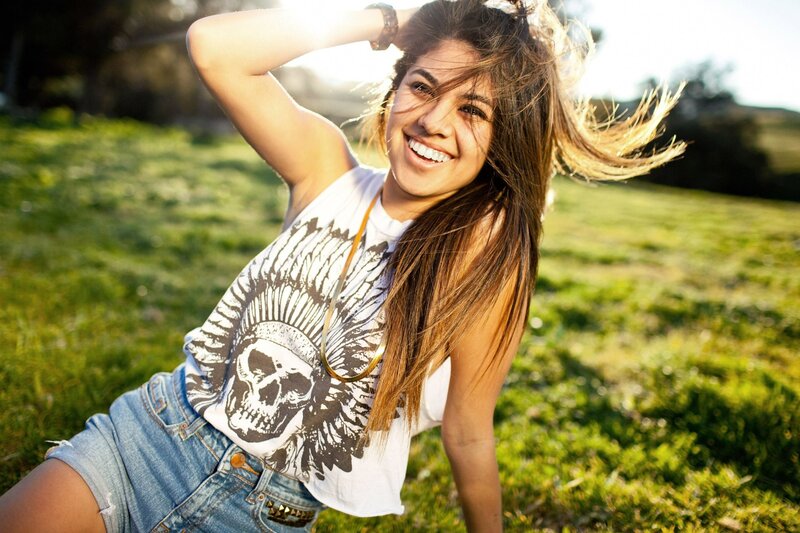 woman smiling in a field