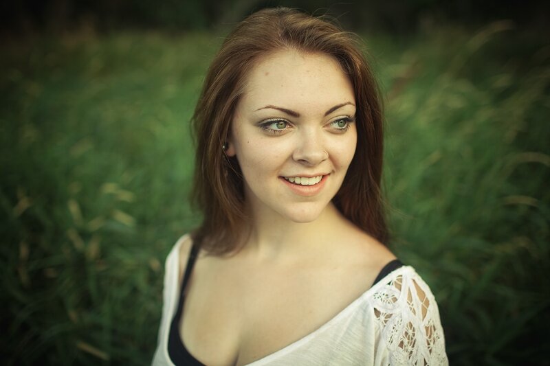 woman smiling in a field