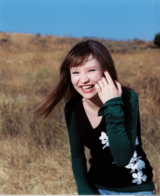 woman smiling in a field