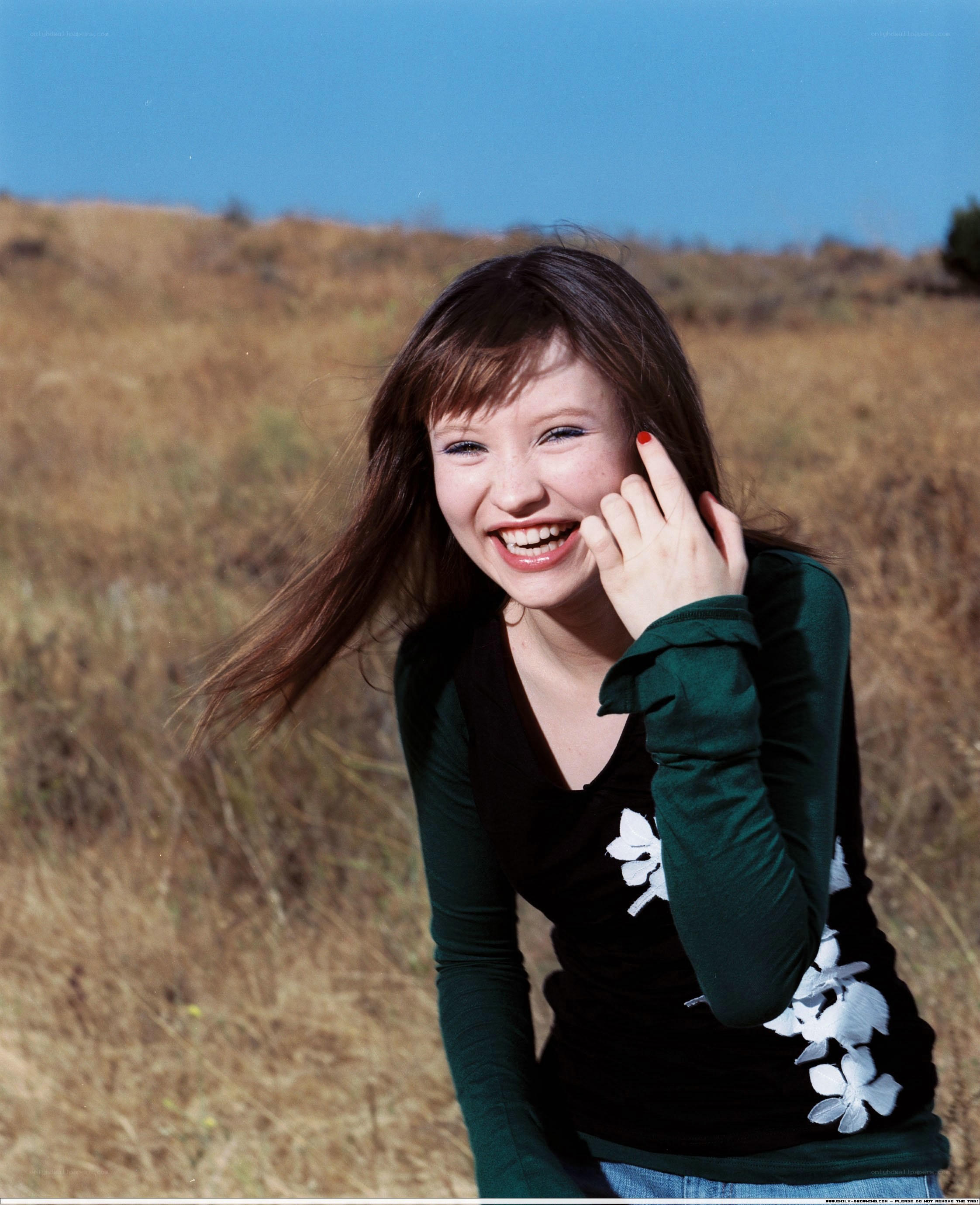 woman smiling in a field