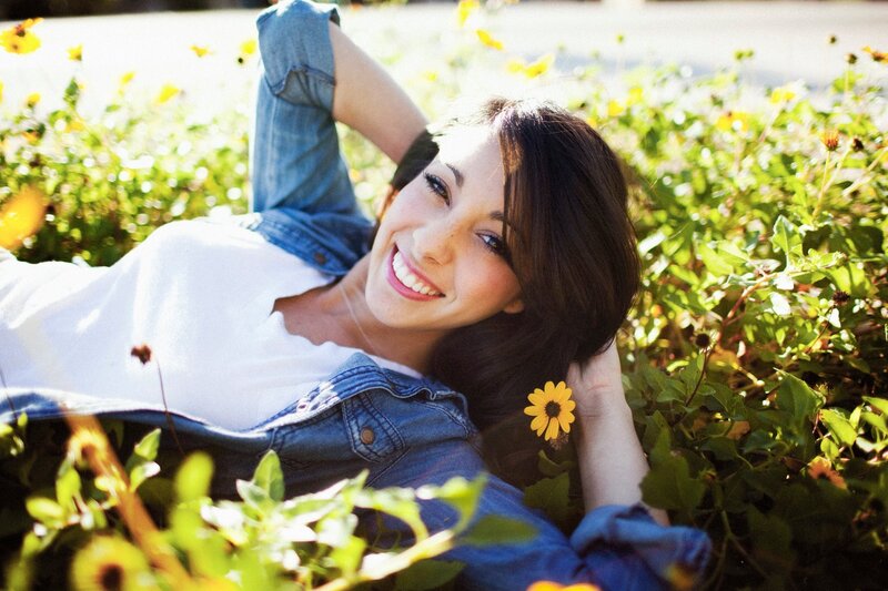Woman smiling in a flower field
