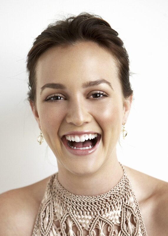 woman smiling in a lace top