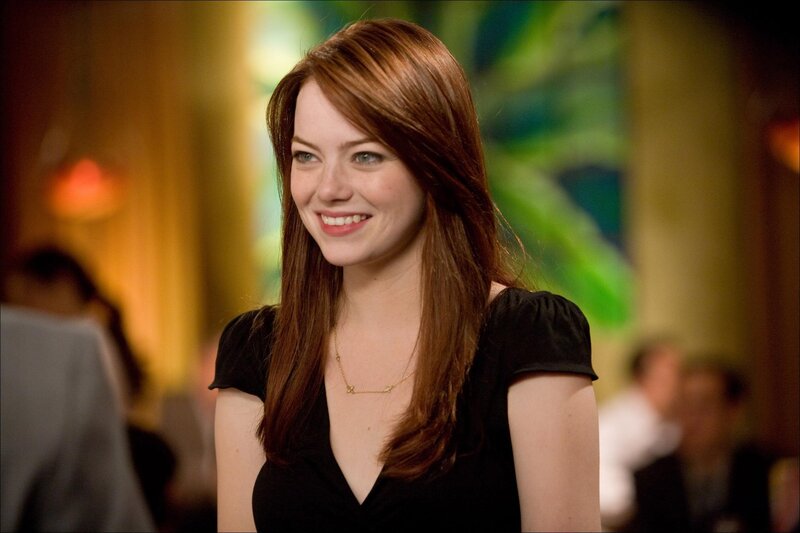 woman smiling in a restaurant
