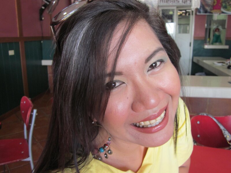 woman smiling in a restaurant