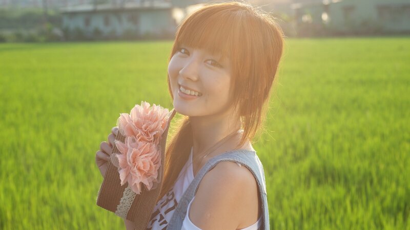 Woman smiling in a rice field