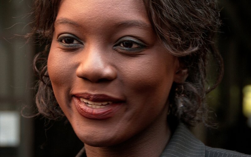 woman smiling in a suit
