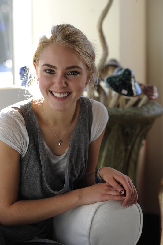 woman smiling in a sunlit room