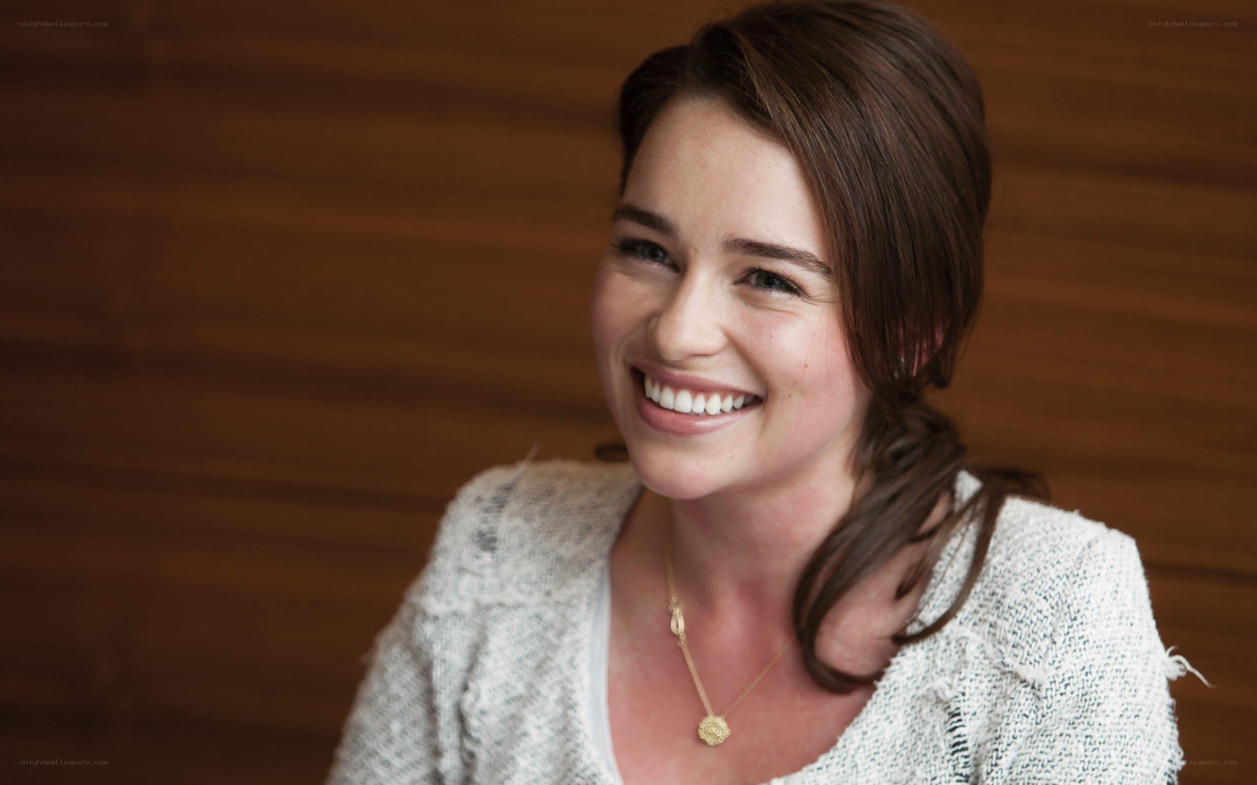 woman smiling in a sweater
