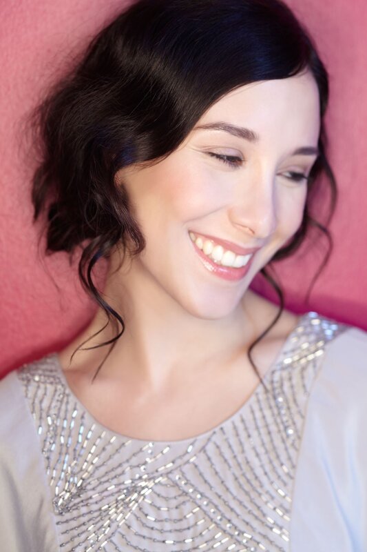 woman smiling in beaded dress
