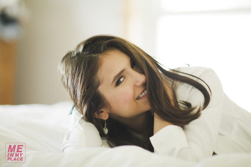 woman smiling in bed