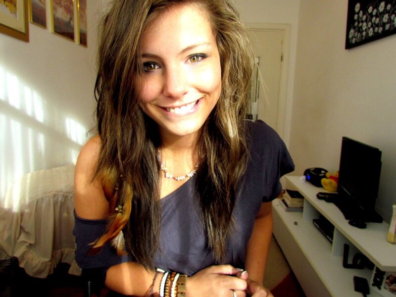 woman smiling in bedroom