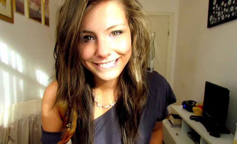 woman smiling in bedroom