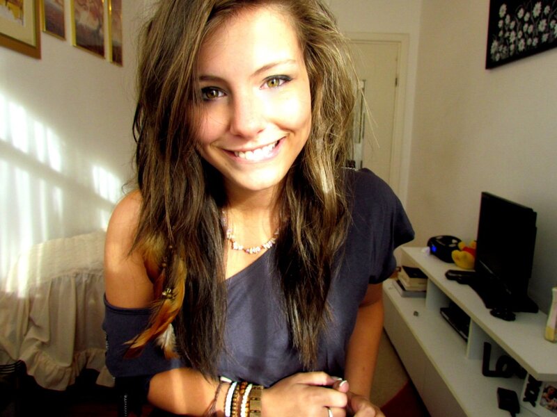 woman smiling in bedroom