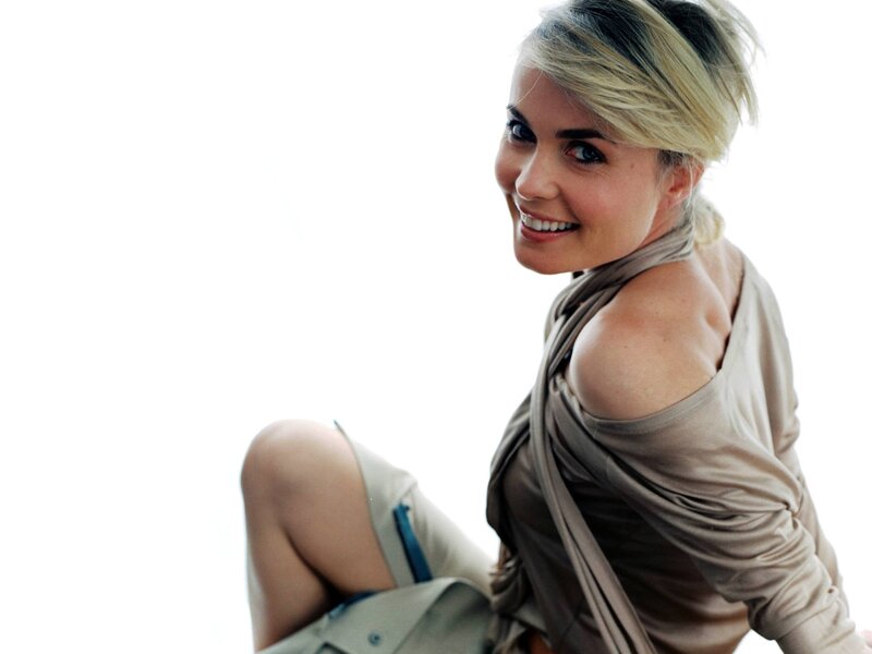 woman smiling in beige top
