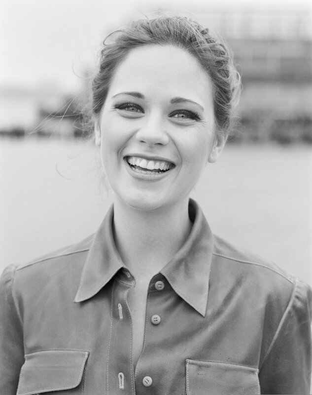 woman smiling in black and white