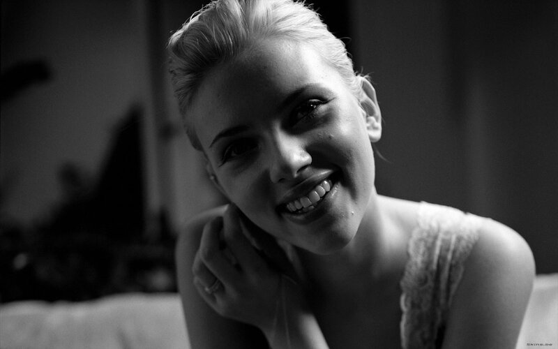 woman smiling in black and white