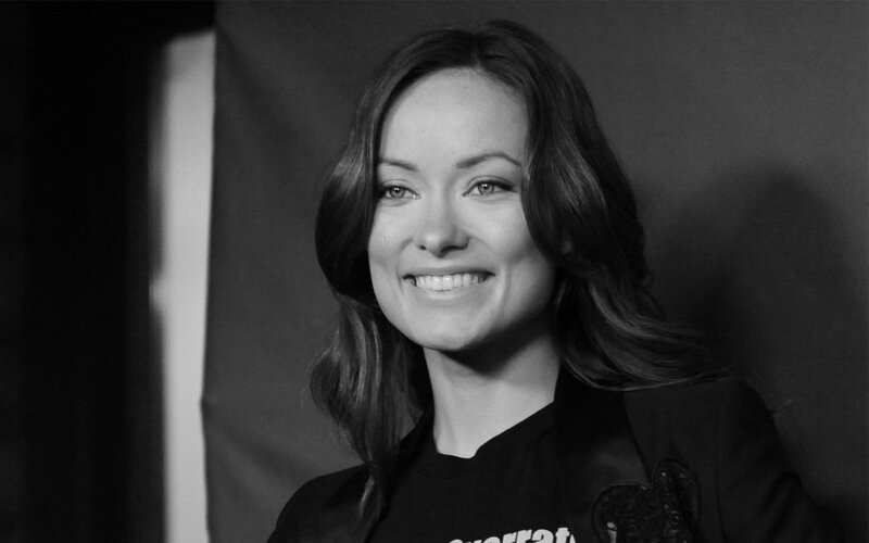 woman smiling in black and white