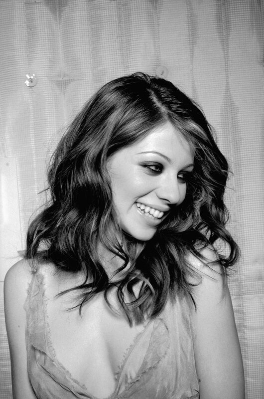 woman smiling in black and white