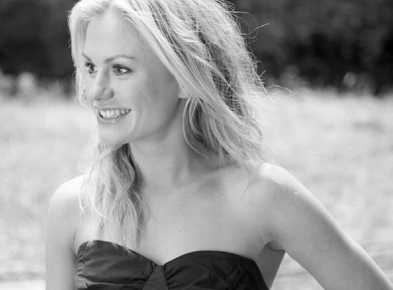woman smiling in black and white
