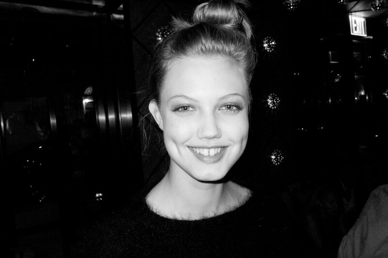 woman smiling in black and white