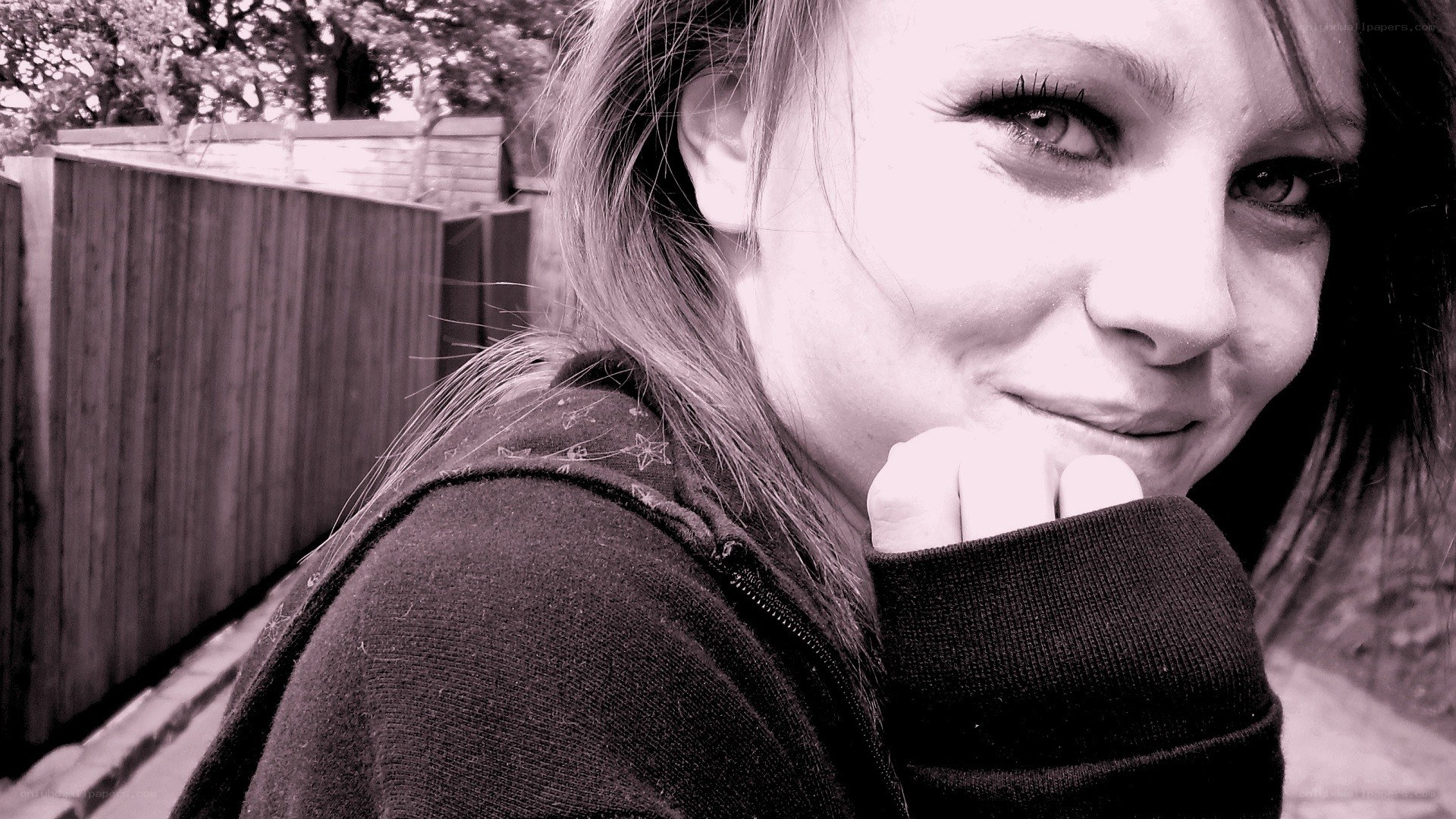 woman smiling in black and white
