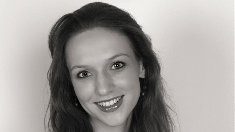 woman smiling in black and white