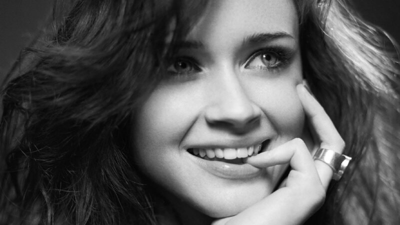 woman smiling in black and white
