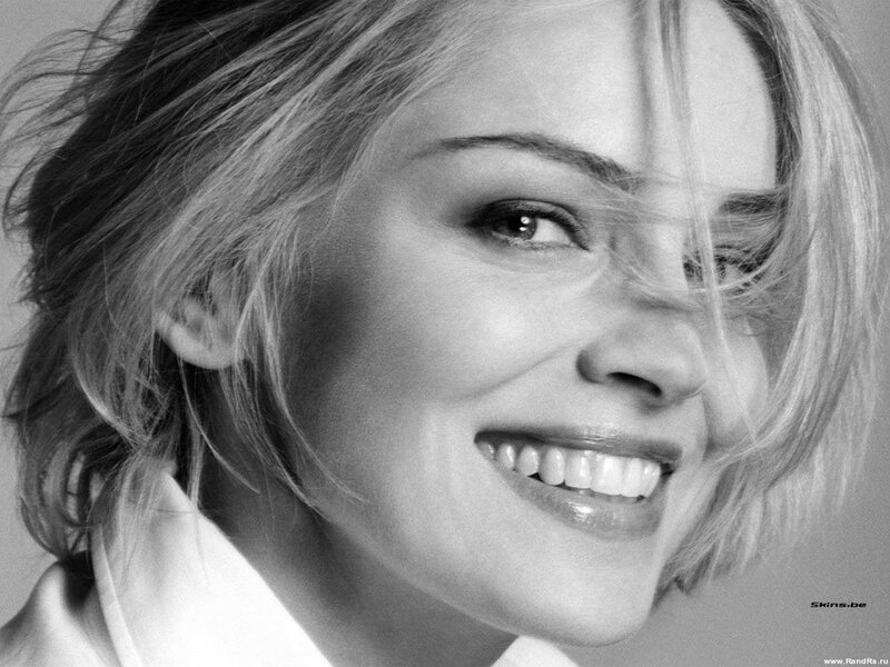 woman smiling in black and white