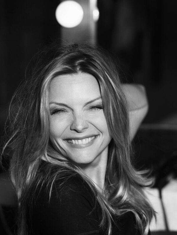 woman smiling in black and white