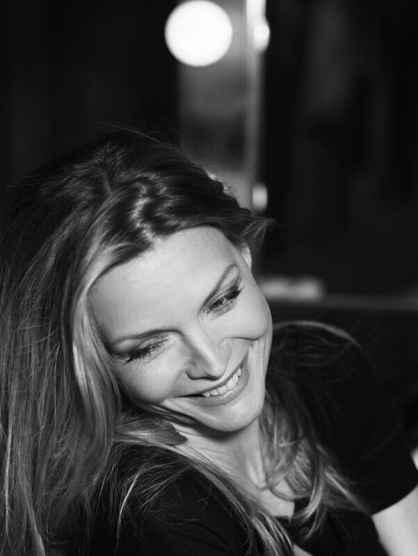 woman smiling in black and white