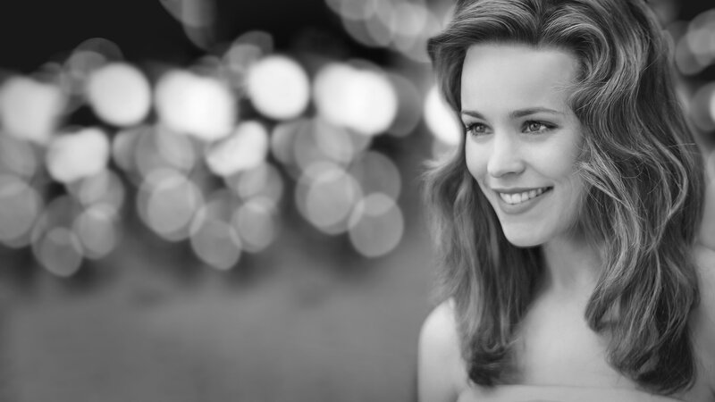 woman smiling in black and white