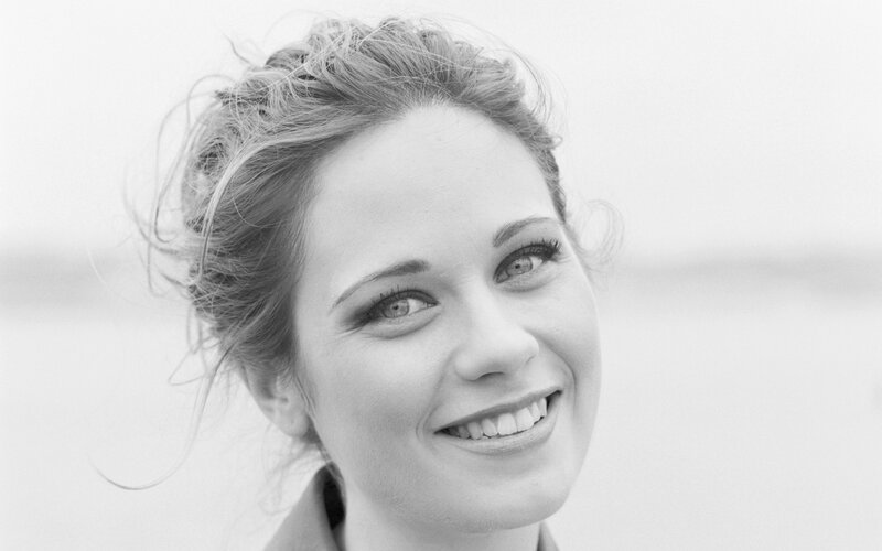 woman smiling in black and white