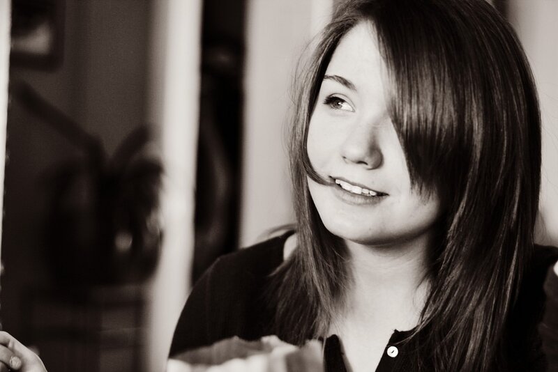 woman smiling in black and white