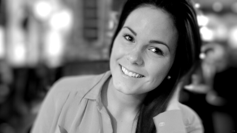 woman smiling in black and white