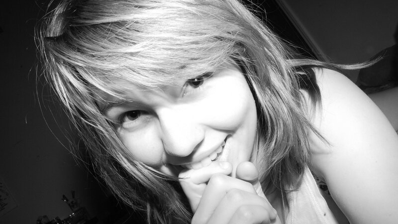 woman smiling in black and white